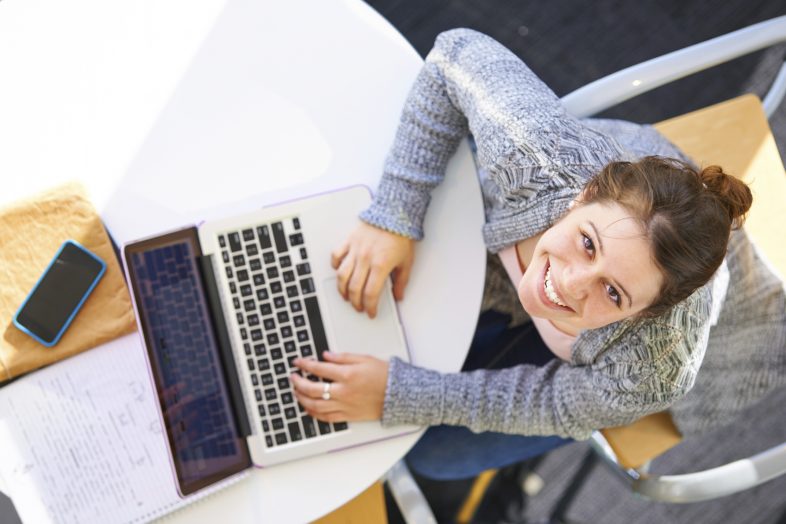 Young woman working on laptop.