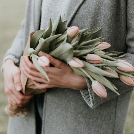 Woman holding flowers, mother's day