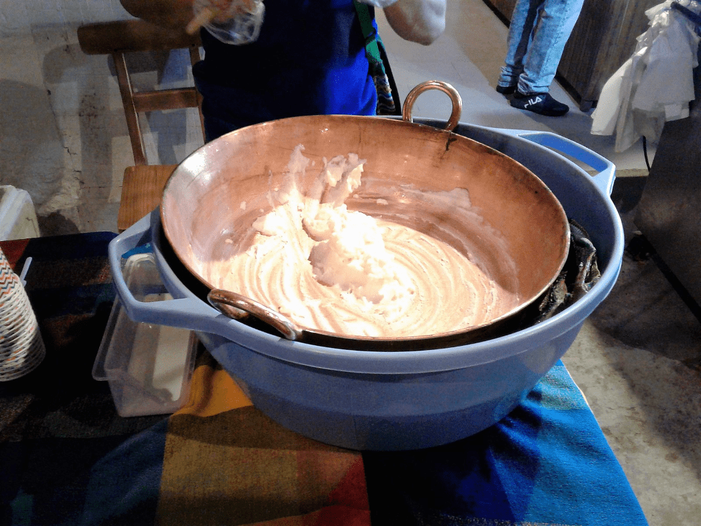 metal pan filled with ice cream inside of a plastic container 